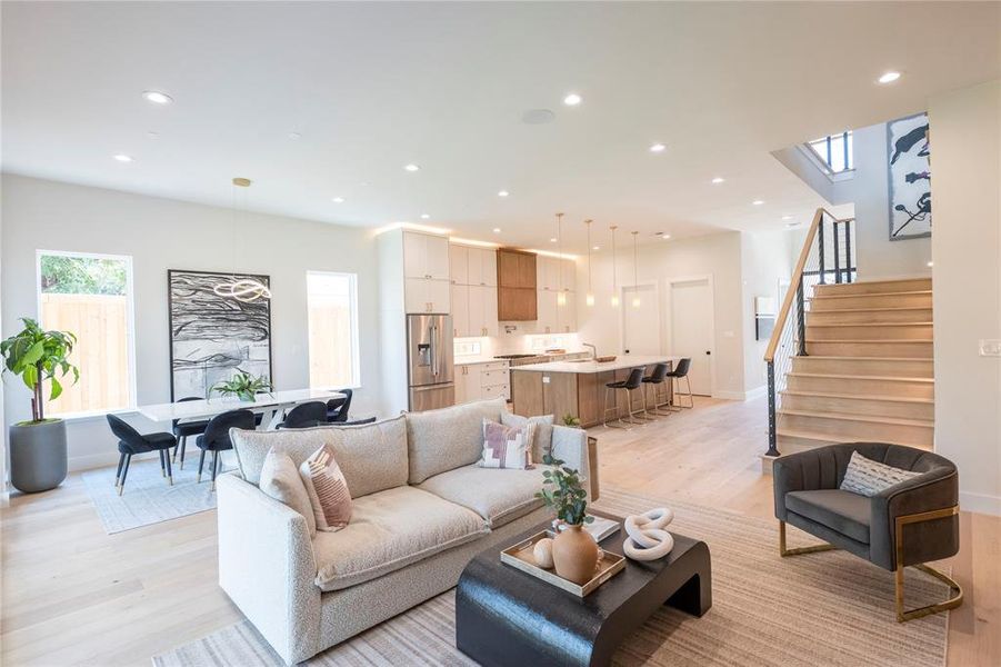 Living room with light hardwood / wood-style floors