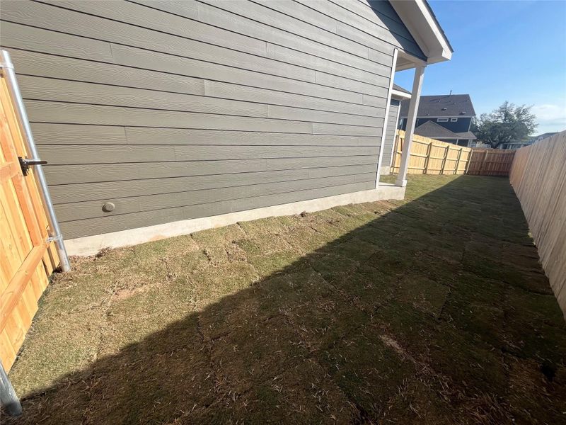 Exterior details and patio area of a home in The Cottages at Lariat, Liberty Hill (Image 20).
