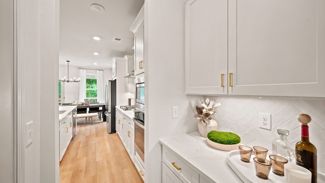 Representative furnished interior of a home built from the Rosemary II by DRB Homes in Westwind Estates, Hampton (Image 12).