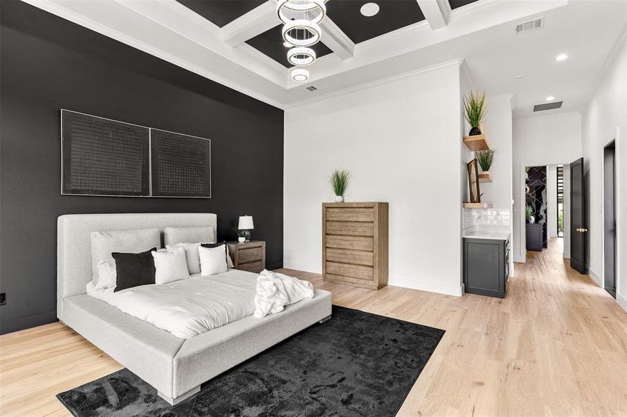 Spacious interior with light wood-finish flooring, a coffered ceiling, and recessed lighting
