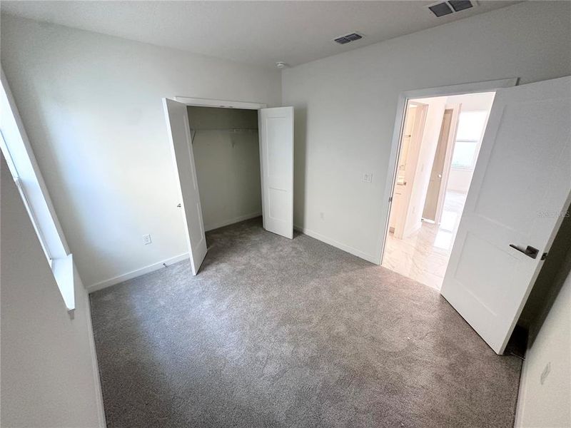 Spacious, unfurnished interior of a new home in Grasslands West, Lakeland (Image 32).