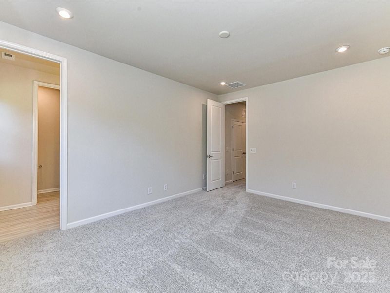 9' Ceilings and 8' Doorways in Primary Suite.