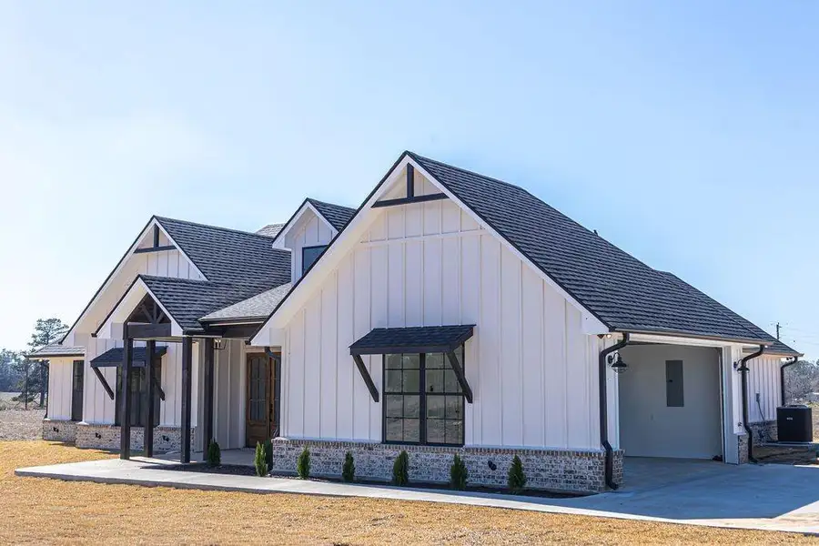 Front exterior of a new home in , Henderson, TX, highlighting curb appeal (Image 25).