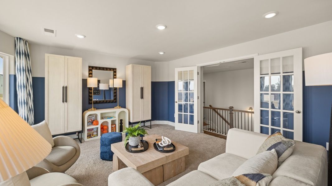 Representative furnished interior of a home built from the Savannah by D.R. Horton in Evergreen Crossing, Locust Grove (Image 34).