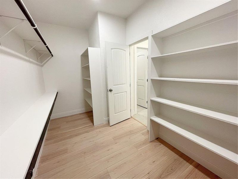 HUGE Primary Closet (plenty of room for lots of shoes)
