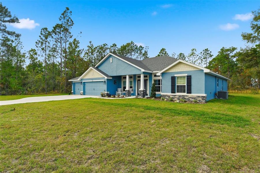 Front exterior of a new home in Royal Highlands, Weeki Wachee, FL, highlighting curb appeal (Image 28).