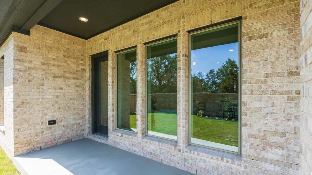 Doorway to property featuring brick siding Doorway to property featuring brick siding