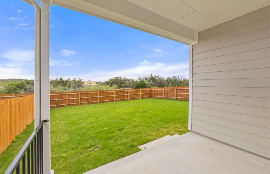 Exterior details and patio area of a home in Saddleback at Santa Rita Ranch, Liberty Hill (Image 27).