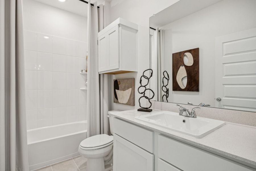 Bathroom in the Trinity home plan by Trophy Signature Homes – REPRESENTATIVE PHOTO