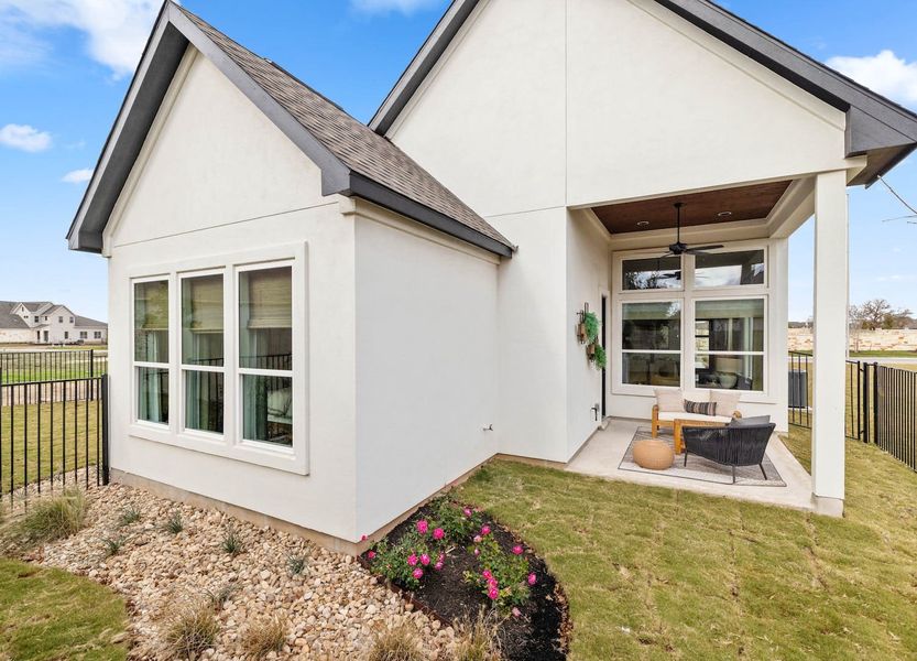 Exterior details and patio area of a home in Santa Rita Ranch – Townhomes, Liberty Hill (Image 3).