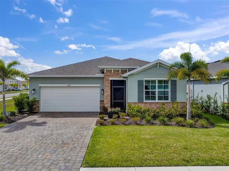Front exterior of a new home in , North Fort Myers, FL, highlighting curb appeal (Image 2).
