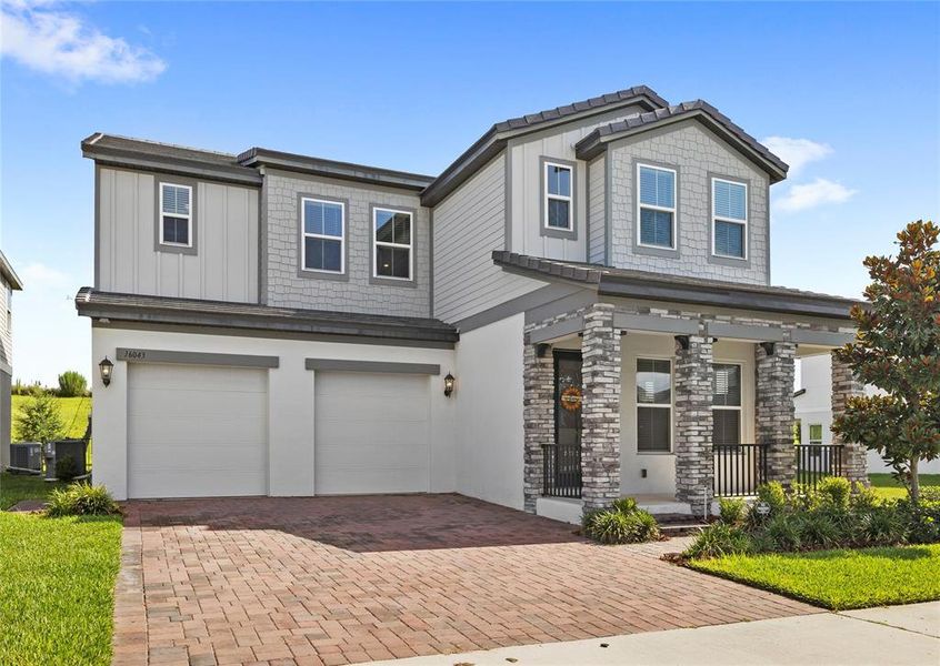 Front exterior of a new home in , Winter Garden, FL, highlighting curb appeal (Image 35).