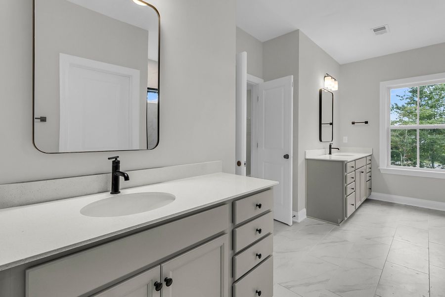 Furnished interior view inside a new home in Tidewater at Lakes of Cane Bay, Summerville (Image 18).