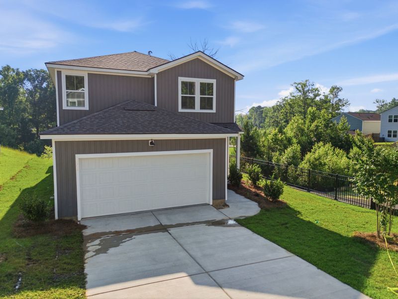 Front exterior of a new home in Grand Arbor, Blythewood, SC, highlighting curb appeal (Image 17).