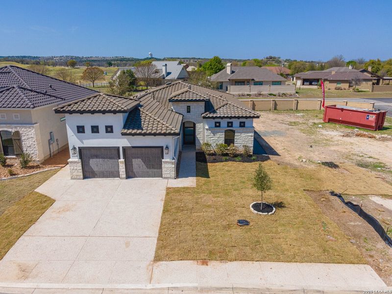 Front exterior of a new home in , Kerrville, TX, highlighting curb appeal (Image 18).