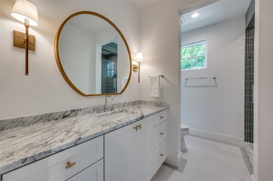 Full bath featuring vanity, recessed lighting, and tile patterned floors Full bath featuring vanity, recessed lighting, and tile patterned floors