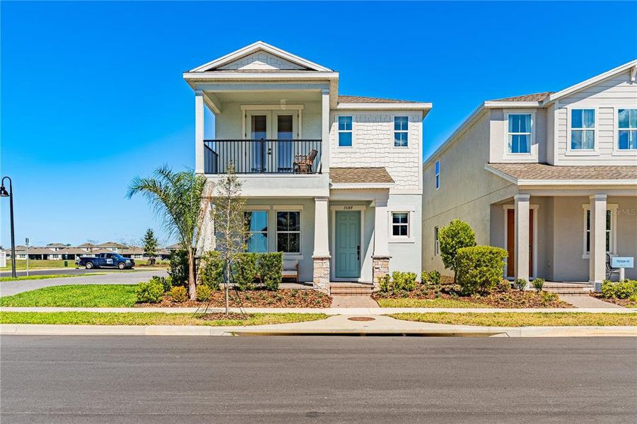 Front exterior of a new home in , Winter Garden, FL, highlighting curb appeal (Image 2). Front exterior of a new home in , Winter Garden, FL, highlighting curb appeal (Image 2).