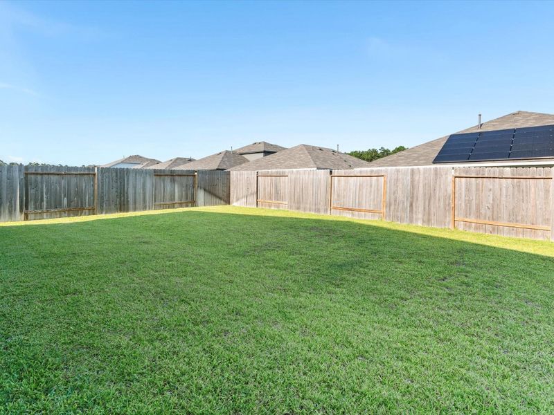 Very Spacious backyard with plenty of room for a garden or pool or both!