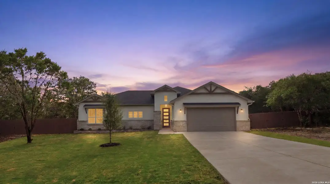 Front exterior of a new home in , Fischer, TX, highlighting curb appeal (Image 1). Front exterior of a new home in , Fischer, TX, highlighting curb appeal (Image 1).