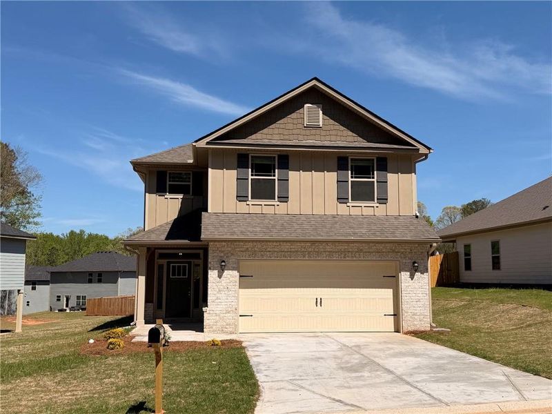 Front exterior of a new home in Magnolia Villas, Cornelia, GA, highlighting curb appeal (Image 15).