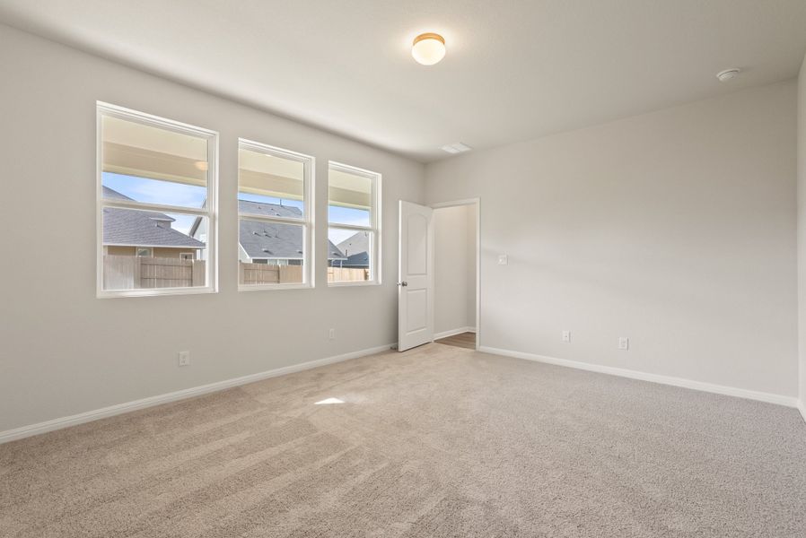 Representative unfurnished interior of a home built from the Somerville by Ashton Woods in Willow Springs, Buda (Image 33).
