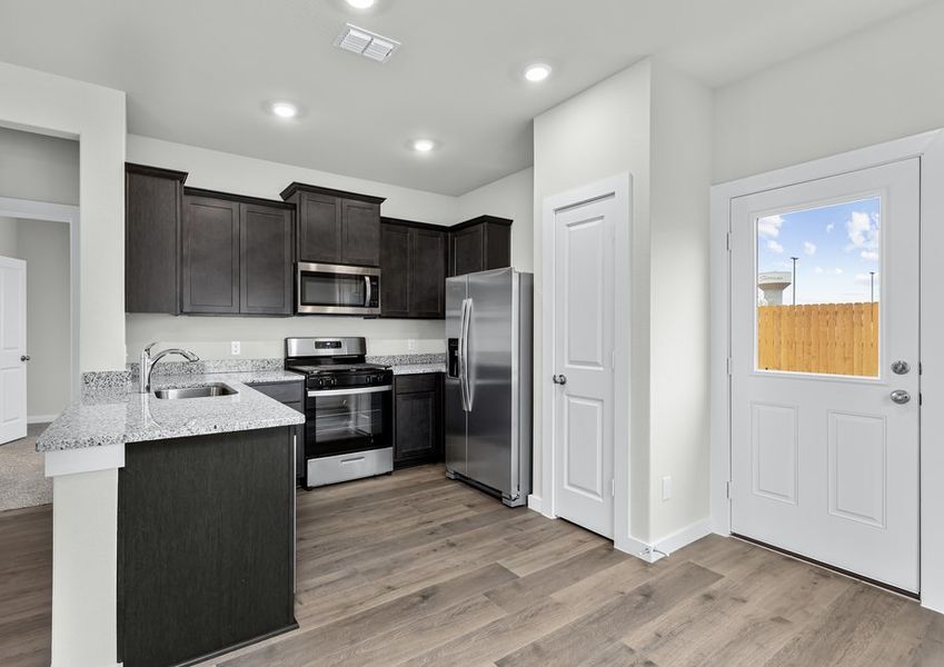 The dining room sits right off of the kitchen. The dining room sits right off of the kitchen.