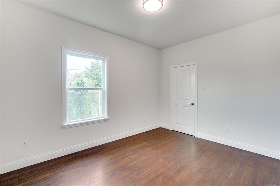 Unfurnished room featuring wood-type flooring