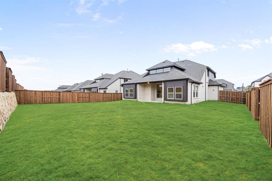Exterior details and patio area of a home in Windsong Ranch Classic 61, Prosper (Image 4). Exterior details and patio area of a home in Windsong Ranch Classic 61, Prosper (Image 4).