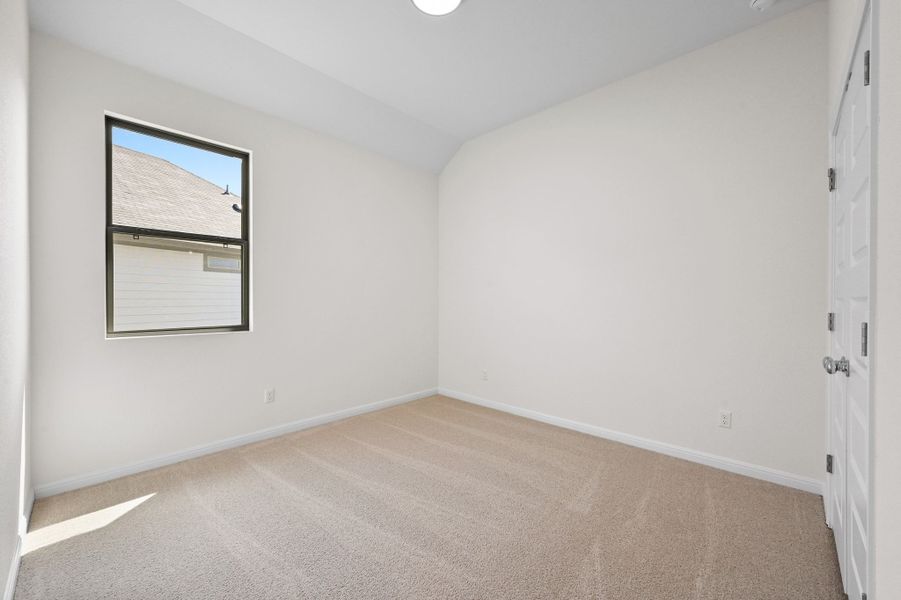 Bedroom in the Cedar home plan by Trophy Signature Homes – REPRESENTATIVE PHOTO