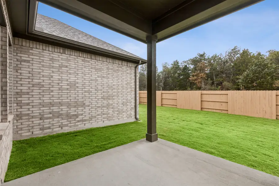 Exterior details and patio area of a home in The Colony, Bastrop (Image 4).