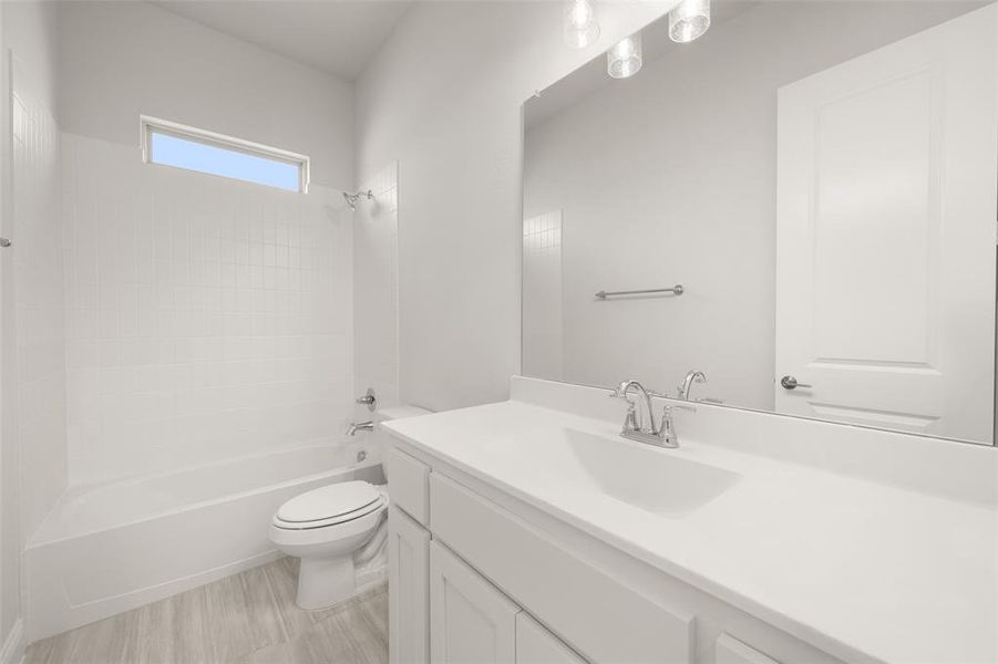 Bathroom with vanity and washtub / shower combination Bathroom with vanity and washtub / shower combination