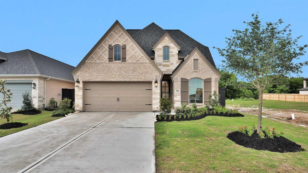 Front exterior of a new home in Harvest Green, Richmond, TX, highlighting curb appeal (Image 2).