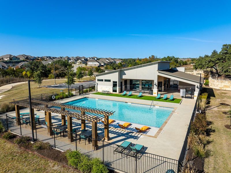 Community pool featuring a patio and a pergola