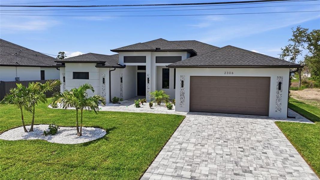 Front exterior of a new home in , Cape Coral, FL, highlighting curb appeal (Image 29).