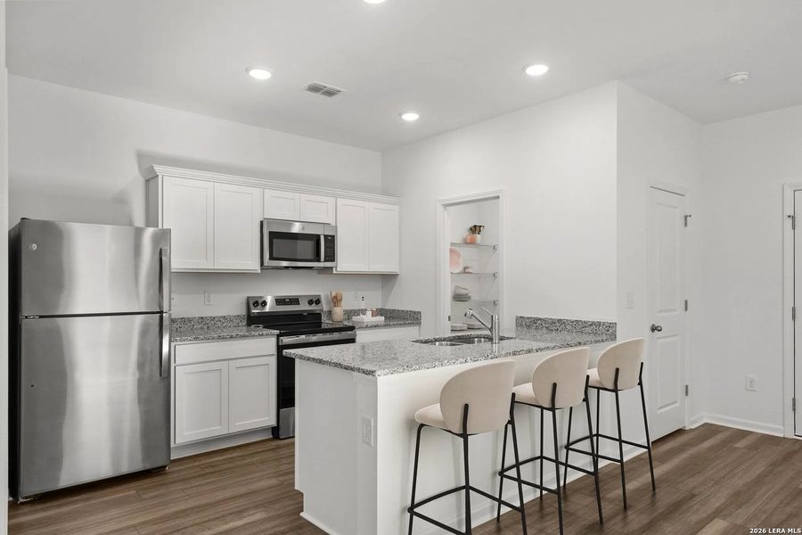 Furnished interior view inside a new home in Sutton Farms, San Antonio (Image 3).