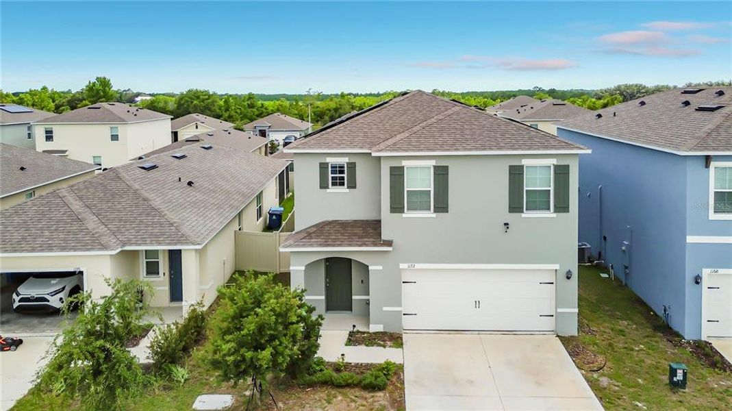 Front exterior of a new home in , Davenport, FL, highlighting curb appeal (Image 1). Front exterior of a new home in , Davenport, FL, highlighting curb appeal (Image 1).