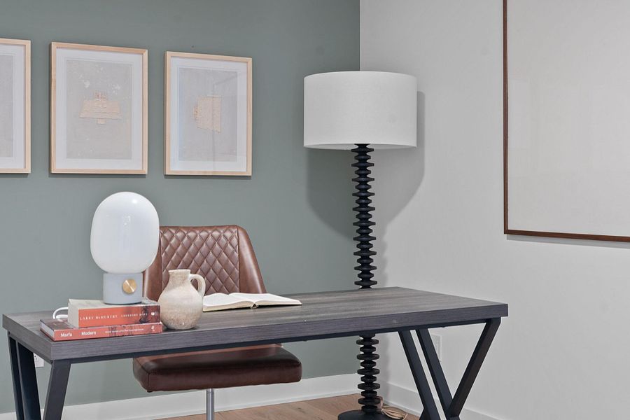Representative Photo. Secondary Bedroom with wood flooring and ceiling fan.