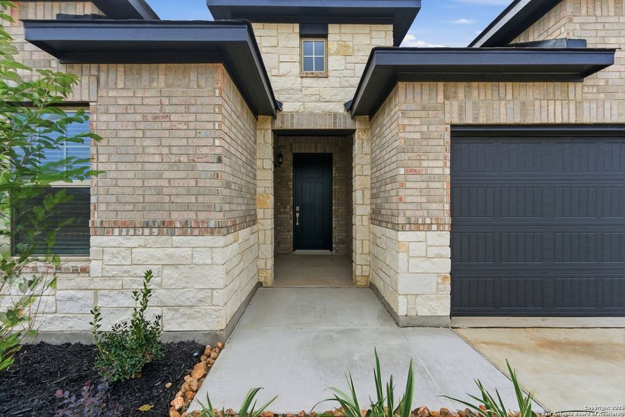 Exterior details and patio area of a home in Alsatian Oaks, Castroville (Image 4).