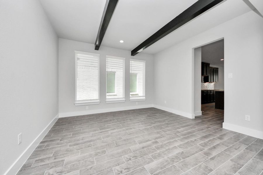 Make memories gathered around the table with your family and friends! This spacious dining room features elegant flooring, custom paint, and adjacent to family room and kitchen for open concept feel.