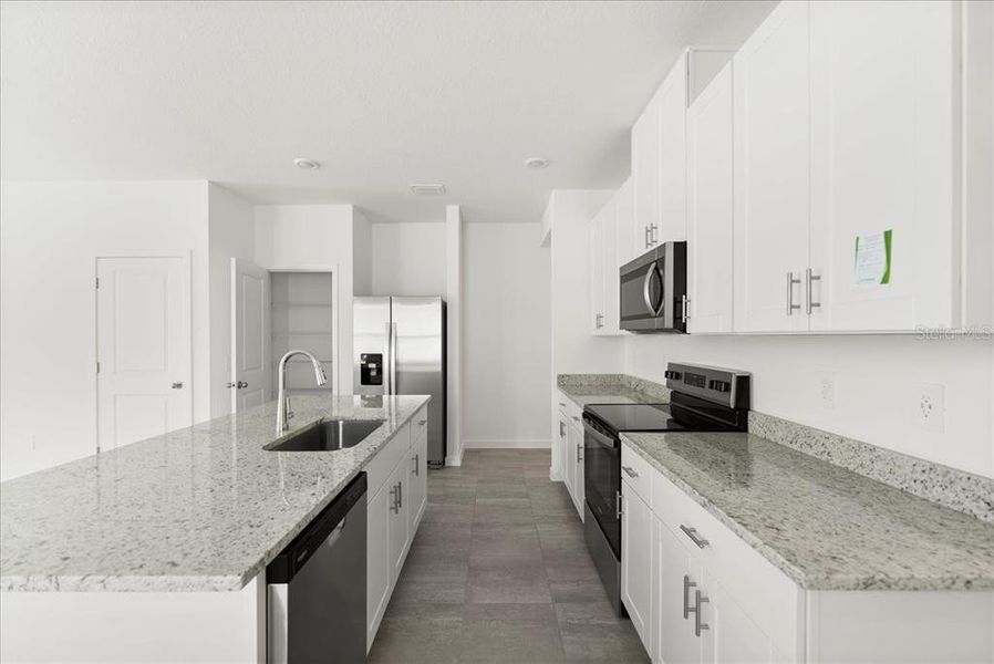 Furnished interior view inside a new home in Flagler Village - Classic Series, Palm Coast (Image 9). Furnished interior view inside a new home in Flagler Village - Classic Series, Palm Coast (Image 9).