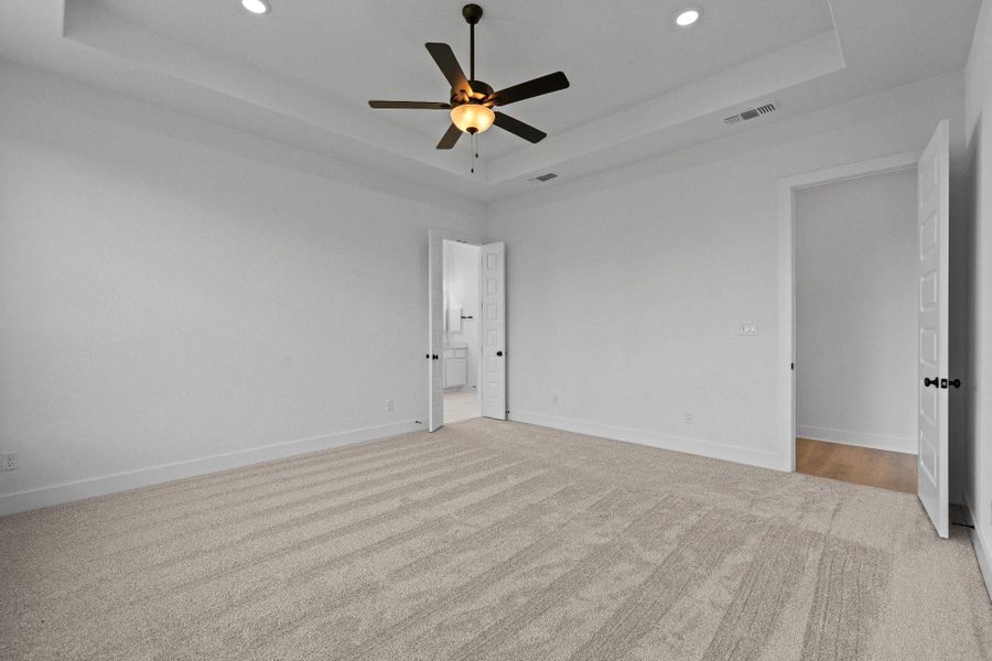 Primary Bedroom with elevated ceiling