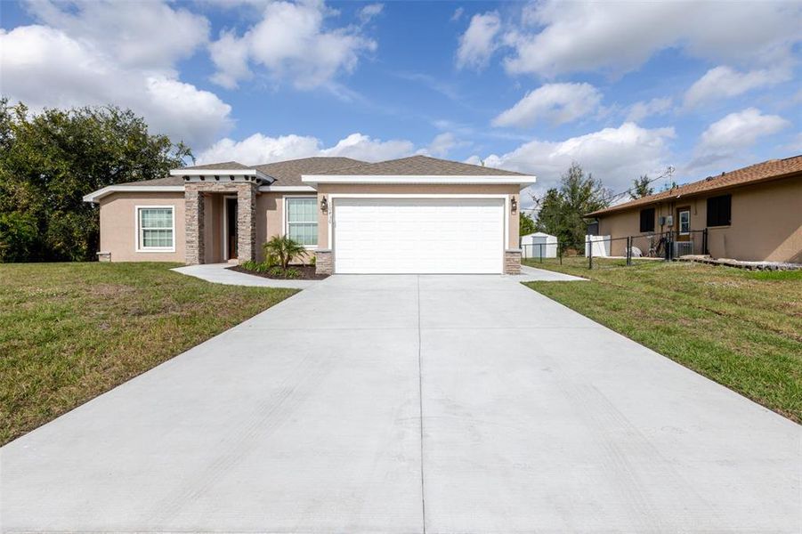 Front exterior of a new home in , Englewood, FL, highlighting curb appeal (Image 22). Front exterior of a new home in , Englewood, FL, highlighting curb appeal (Image 22).