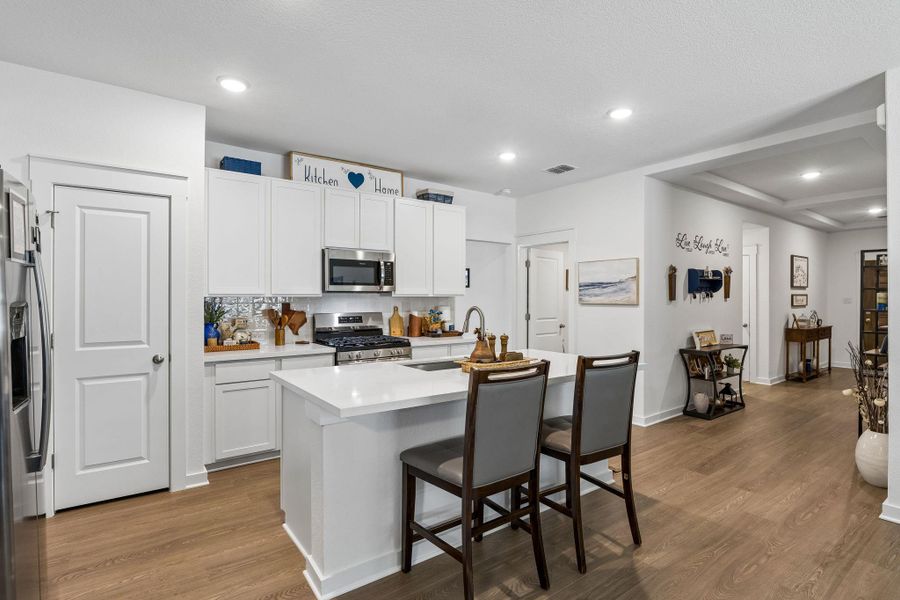 Kitchen offers lots of storage and large pantry.