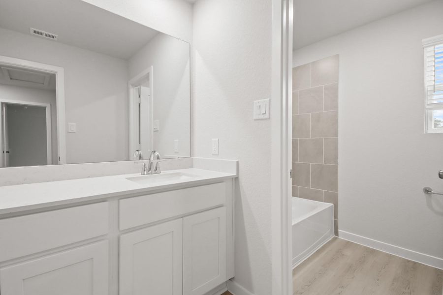 Furnished interior view inside a new home in Lakes at Black Oak, Magnolia (Image 9).