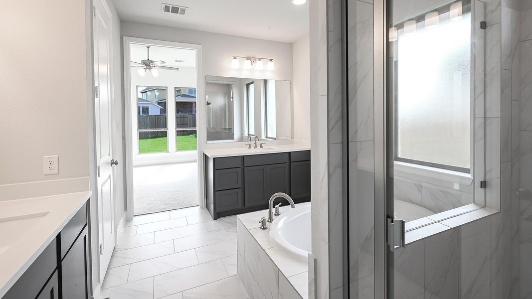 Furnished interior view inside a new home in 6 Creeks 50', Kyle (Image 12).