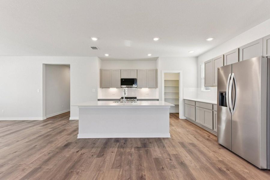 Furnished interior view inside a new home in Stallion Run, Buda (Image 13).