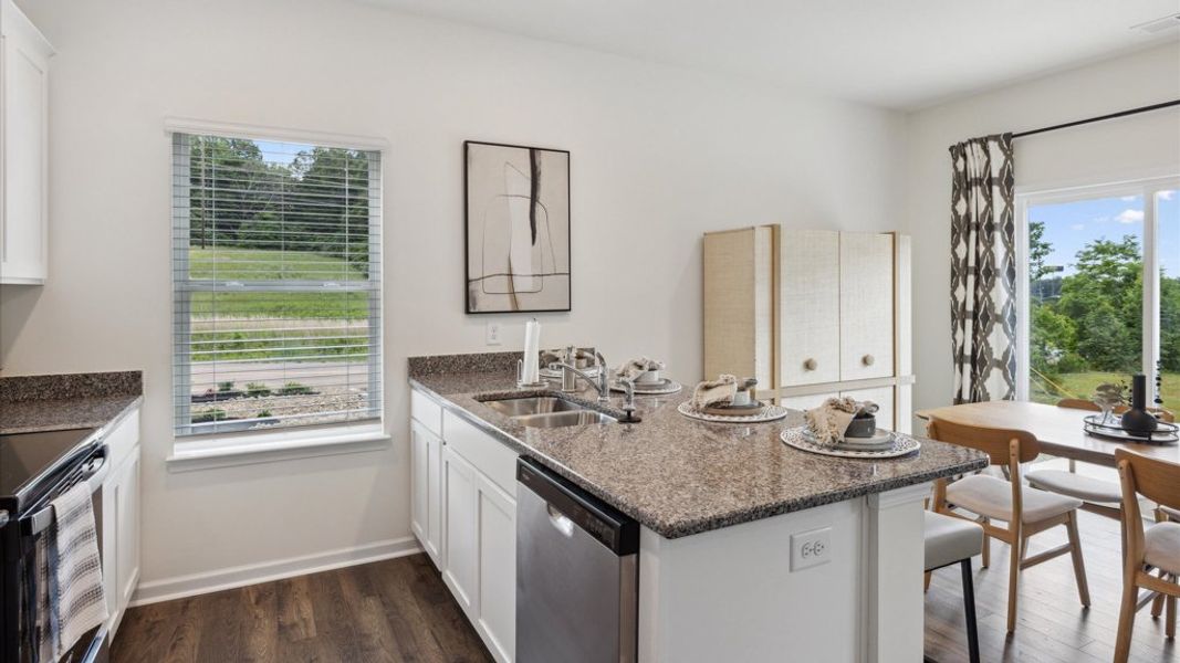 Representative furnished interior of a home built from the Altamont Townhome by D.R. Horton in Saint Marc's, Powell (Image 6).