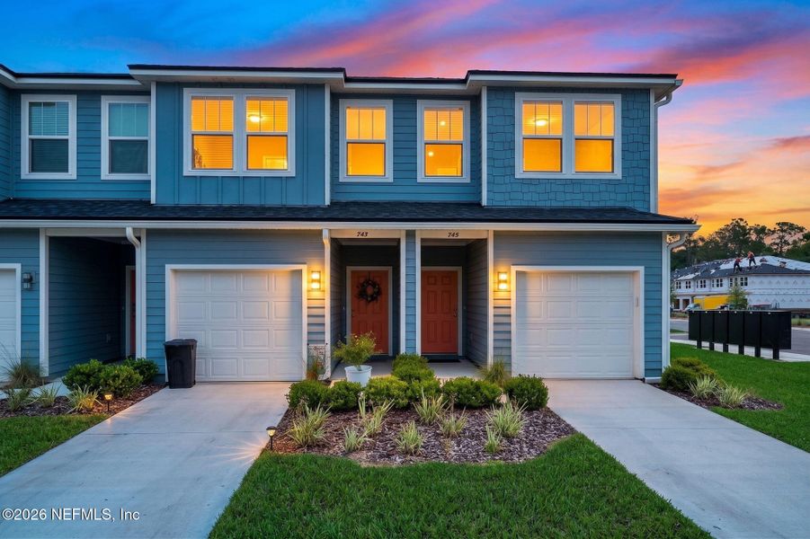Front exterior of a new home in Kasen Oaks, Jacksonville, FL, highlighting curb appeal (Image 24).