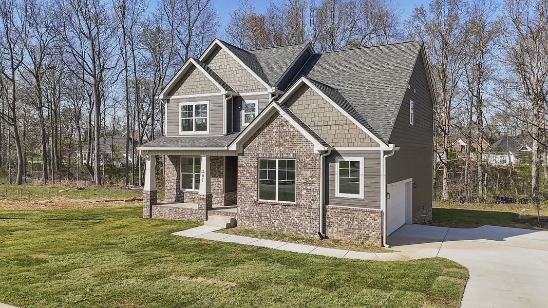 Representative exterior photo of a completed home built from the Two Story Farmhouse by Norfleet Builders in Cambria, White House, TN (Image 10).