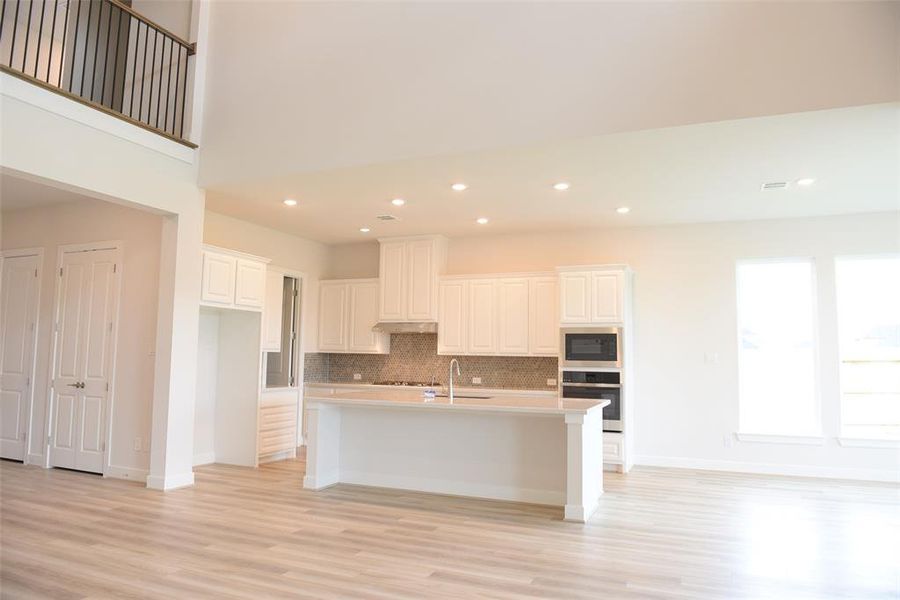 open kitchen with high ceiling,